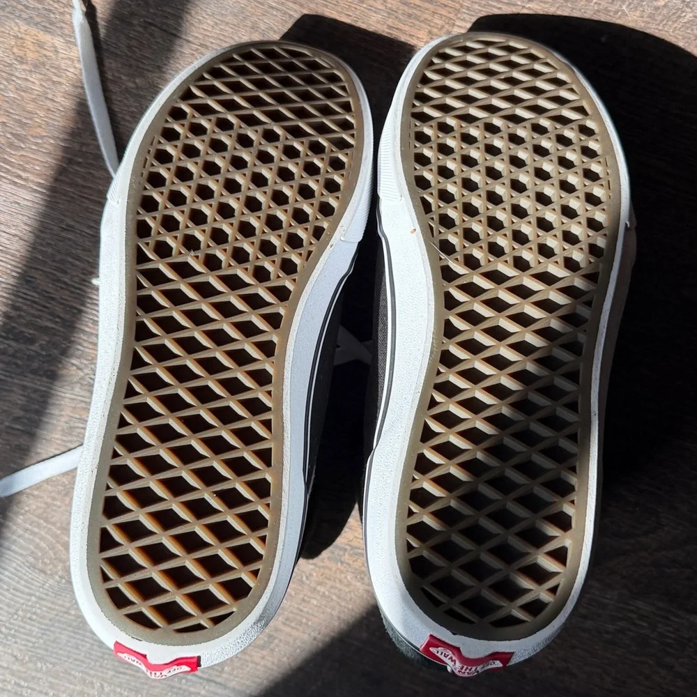 Vans Off The Wall Black and White High-Top Skate Sneakers